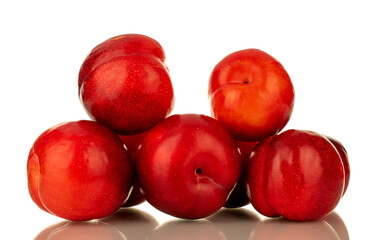 Several juicy sweet, red plums, close-up, isolated on white.
