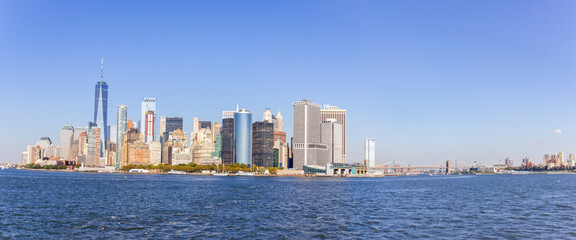 A picture of Manhattan skyline with Battery Park and Maritime terminals, bridges and Brooklyn, NY, USA