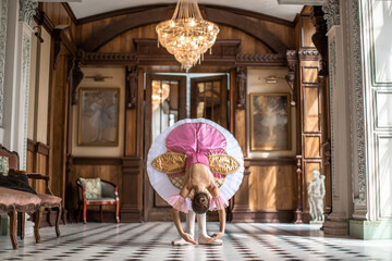 Ballerina girl stay in beautiful ballet tutu dress in a beautiful designed room