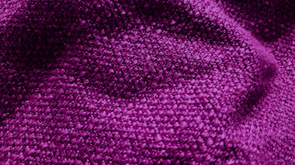Fototapeta na wymiar close up yarn violet textile fabric background showing beautiful wavy or crumpled pattern. wool fabric texture close up background. purple comfortable style cloth. wavy folds material.