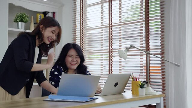 Asian secretary consulting fat woman boss at office, business idea, success
