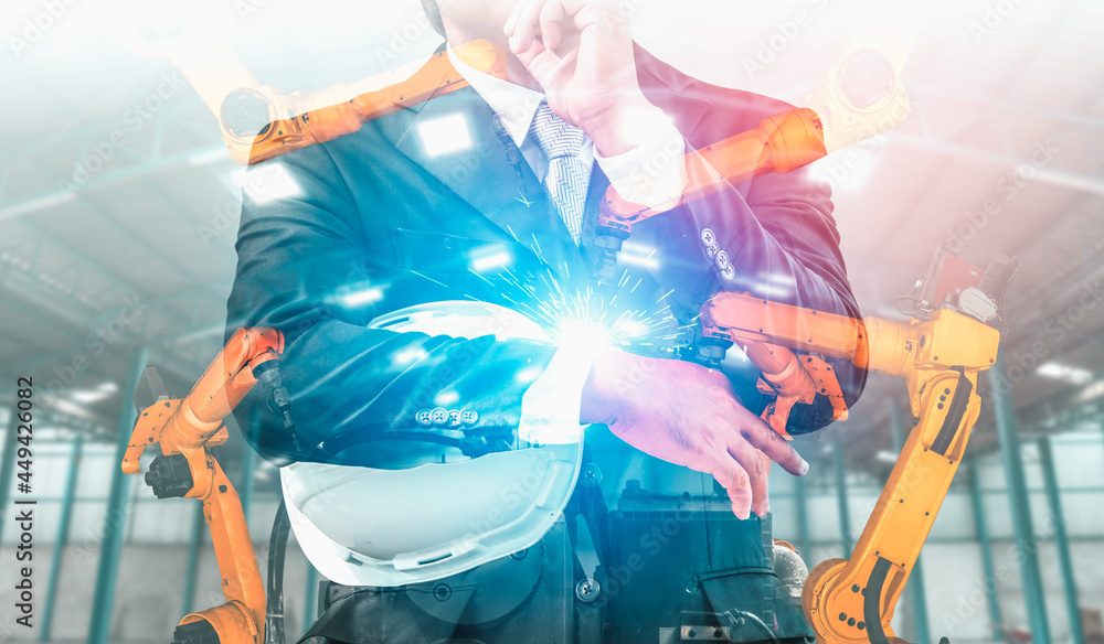 Poster mechanized industry robot arm and factory worker double exposure . concept of robotics technology fo