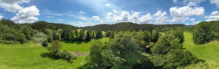 Fototapeta premium Panorama landscape from the air in the Bavarian Danube area with cloudy summer sky