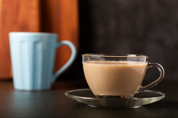 Cup of coffee with creamy milk.