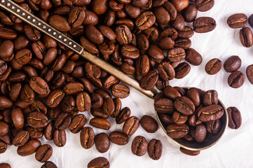 Natural background for Cafe menu or brochure template - macro photo of brown roasted coffee beans, close up