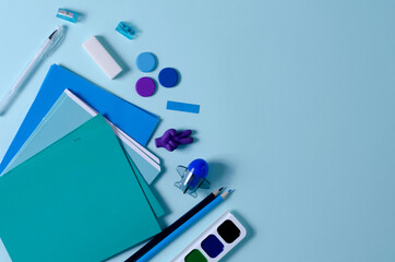 Goods for school, study, drawing monochrome colors on a blue background, copying space and flat layout