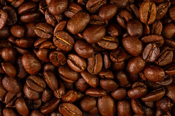 Natural background for Cafe menu or brochure template - macro photo of brown roasted coffee beans, close up