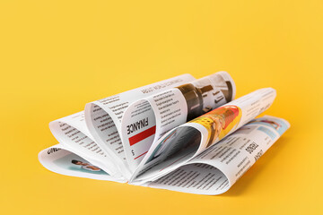 Many newspapers on color background