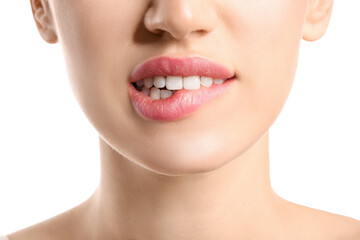 Young woman with beautiful lips on white background, closeup