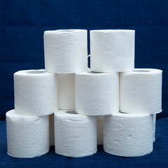 Toilet paper on a dark blue background. Personal hygiene items.