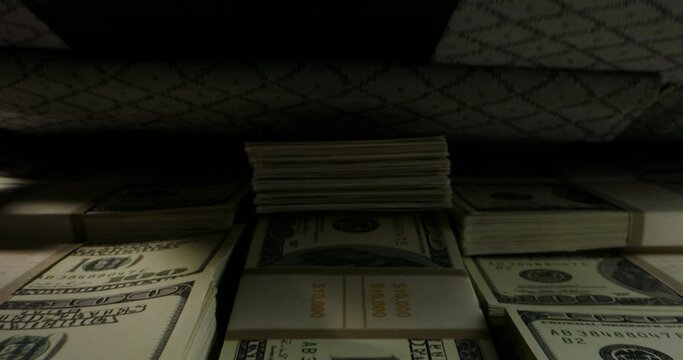 Close up shot of briefcase full of 100 US dollars packs getting closed. A suitcase stuffed with cash. Currency, cash flow, business and financing 4k footage