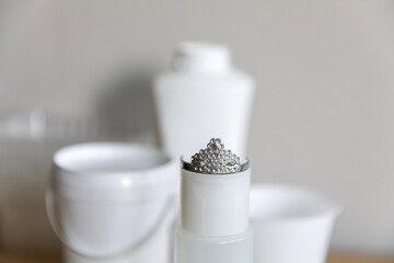 Plastic is the king of packaging. Plastic bottle in a toy crown. The concept of the prevalence of plastic packaging