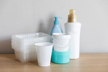 Different types of plastic package in everyday life. Bottles cleaned from labels and prepared for separate collection of waste