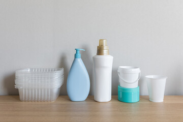 Different types of plastic package in everyday life. Bottles cleaned from labels and prepared for separate collection of waste