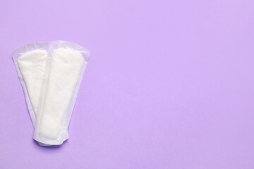 Menstrual pads on color background