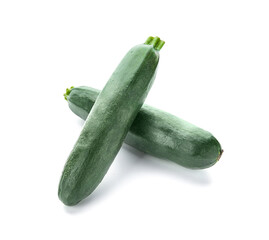 Fresh zucchini squashes on white background