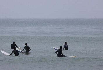 surfers waiting for a wave  the beac