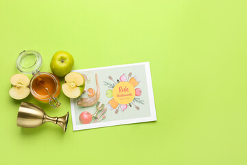 Greeting card for Rosh hashanah (Jewish New Year) with symbols on color background