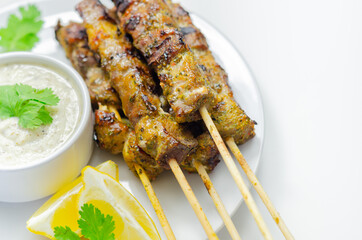 Pork shoulder kebabs with a lemon and herb rub and a garlic and mint yogurt sauce