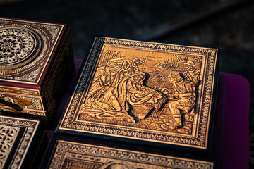 handmade birch bark boxes with images of animals at the fair of masters