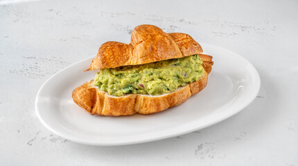Croissant with guacamole