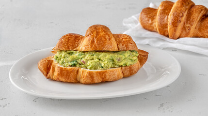 Croissant with guacamole