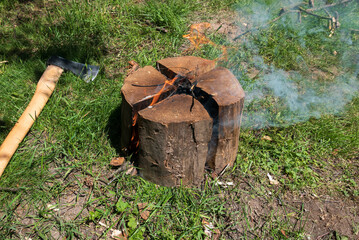 Preparing Swedish torch during survival trip