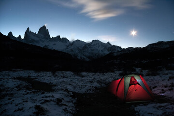 Night camping at the base of Cerro Fitz Roy under the moonlight. El Chalten Patagonia Argentina. Freedom adventure concept - obrazy, fototapety, plakaty
