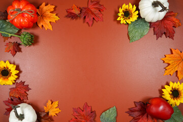 Autumn Fall, Halloween, Thanksgiving theme flat lay background with pumpkins and maple leaves. Negative copy space.