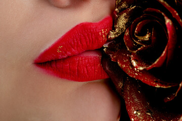 Beautiful red lips close-up. Classic red lips with sexy smirk. Textured lips with gloss red...