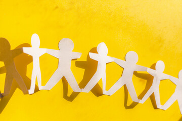 Human team of paper chain people color background.