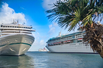 Cruise ships in port with one sailing  in the Bahamas