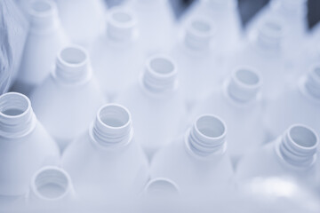 cosmetics production - industry - plastic packaging - white plastic bottles