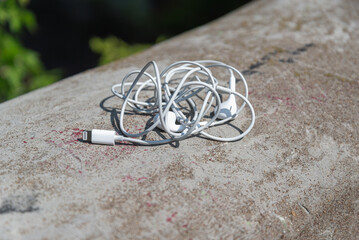 Headphones from the phone (player) forgotten on the street.
