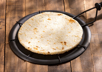 Arepa of ground corn - Traditional Colombian food