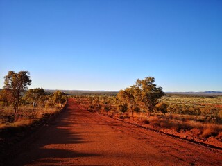 Fototapeta na wymiar Red dusty roads. Roadtrip Australia