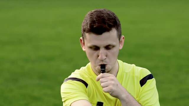 Referee goes watching VAR or violation of the rules and shows a penalty, yellow or red card . Concept of sport, rules violation, offside.