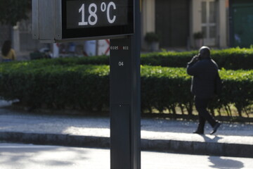 Temperature thermometer on street displays digital celsius degrees. Meteorology and weather device, climate change, global warming indicator.