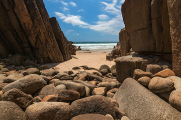 Fototapeta na wymiar a rocky beach with sand and water