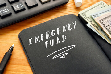 Business concept about EMERGENCY FUND with inscription on the page.
