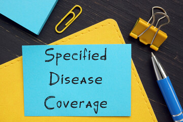  Financial concept about Specified Disease Coverage with phrase on the page. - obrazy, fototapety, plakaty