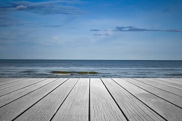 Wood perspective on sea image background. Empty top of wooden table. wood table top on blurred blue sea