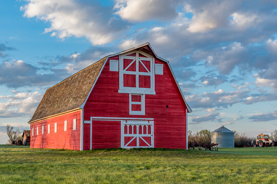 Vintage Red Barn In A Farmyard On The Prairies In Saskatchewan 