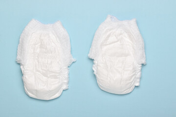 Background with baby diapers. Flat layout, top view, a place to copy.