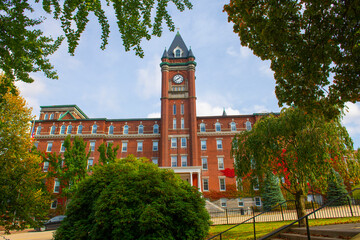 O'Kane Hall in College of the Holy Cross with fall foliage in city of Worcester, Massachusetts MA, USA.