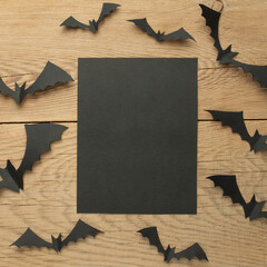 Background for Halloween, with bats on a wooden background