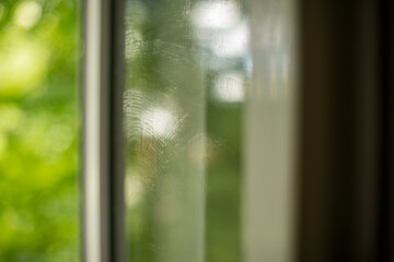 Fototapeta premium The surface of the washed window. Glass on a summer day.
