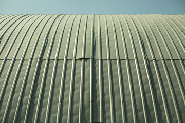 Hangar roof made of stainless steel. Arched roof of a metal structure.