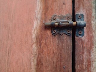Ancient door hinge. Rusted door hinges.