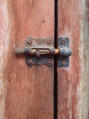 Ancient door hinge. Rusted door hinges.